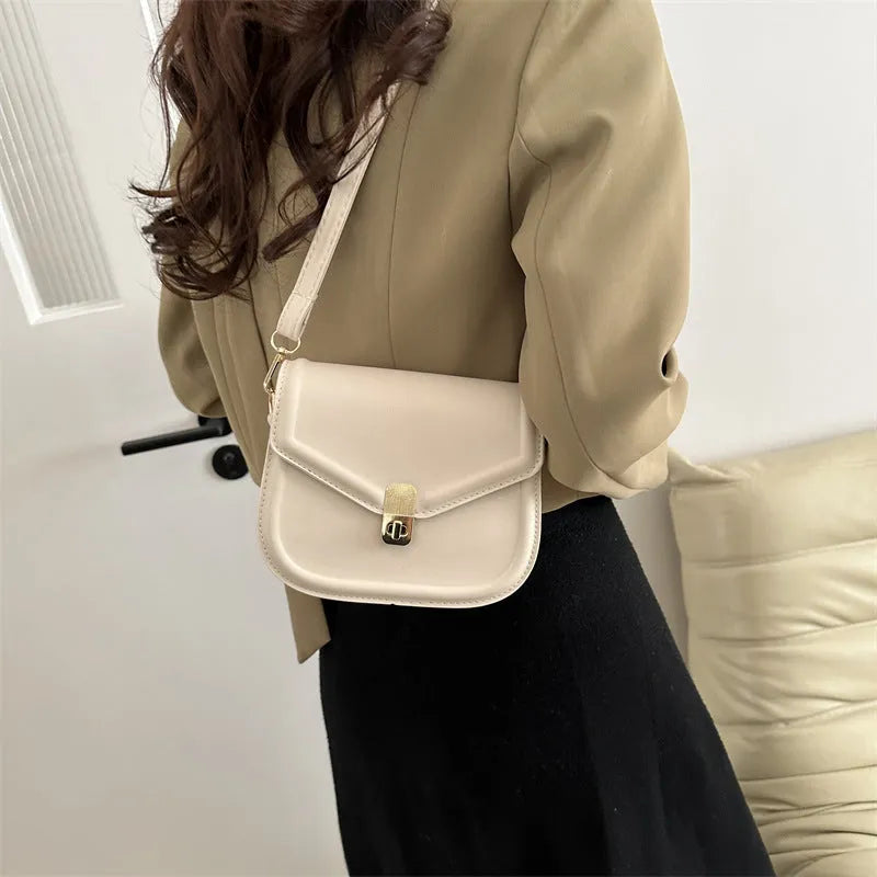 Soft PU leather horizontal square messenger bag with clamshell opening in khaki colour.