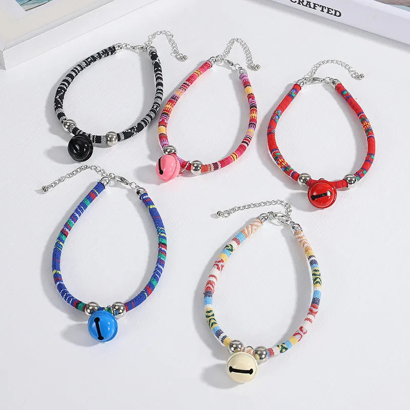 Ethnic style pet collar with bell necklace in five colours including black, blue, pink, red, and white
