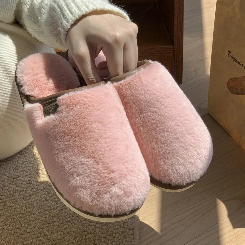 Winter plush slippers in solid colours with non-slip PVC soles and car stitching detail