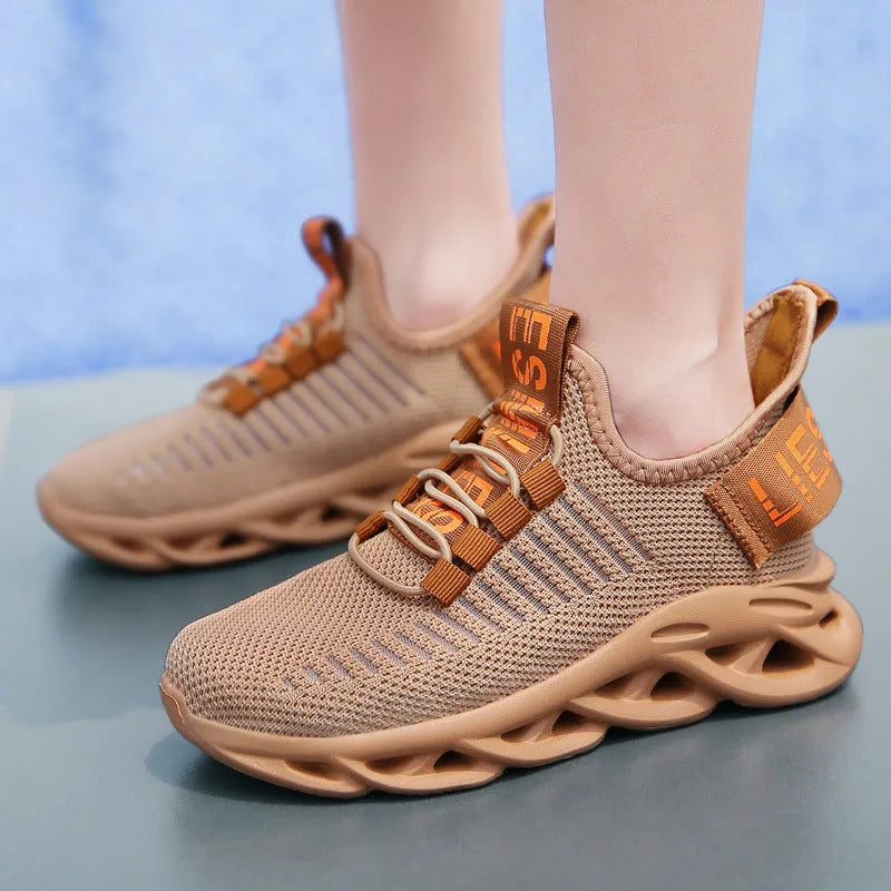 Kids black coconut sneakers with Velcro strap on a breathable fabric upper
