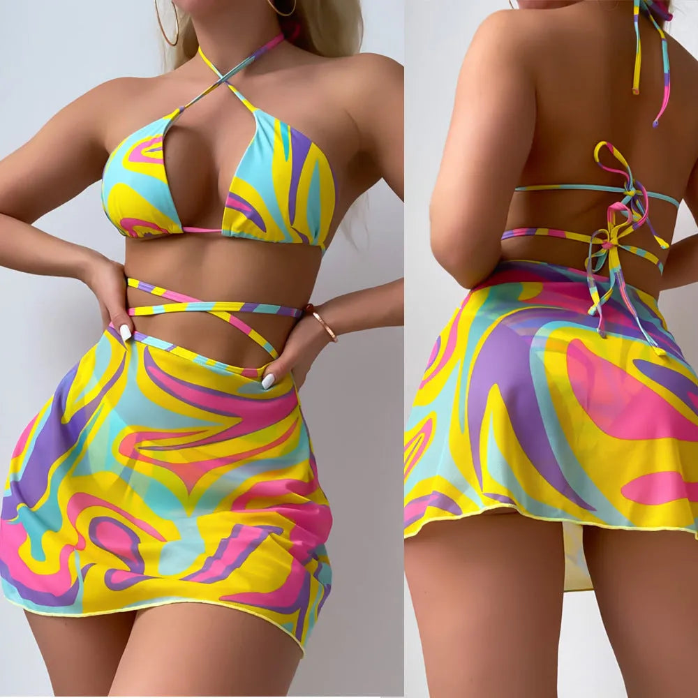 Yellow striped halter lace-up swimsuit set for women, showing top, skirt, and shorts.