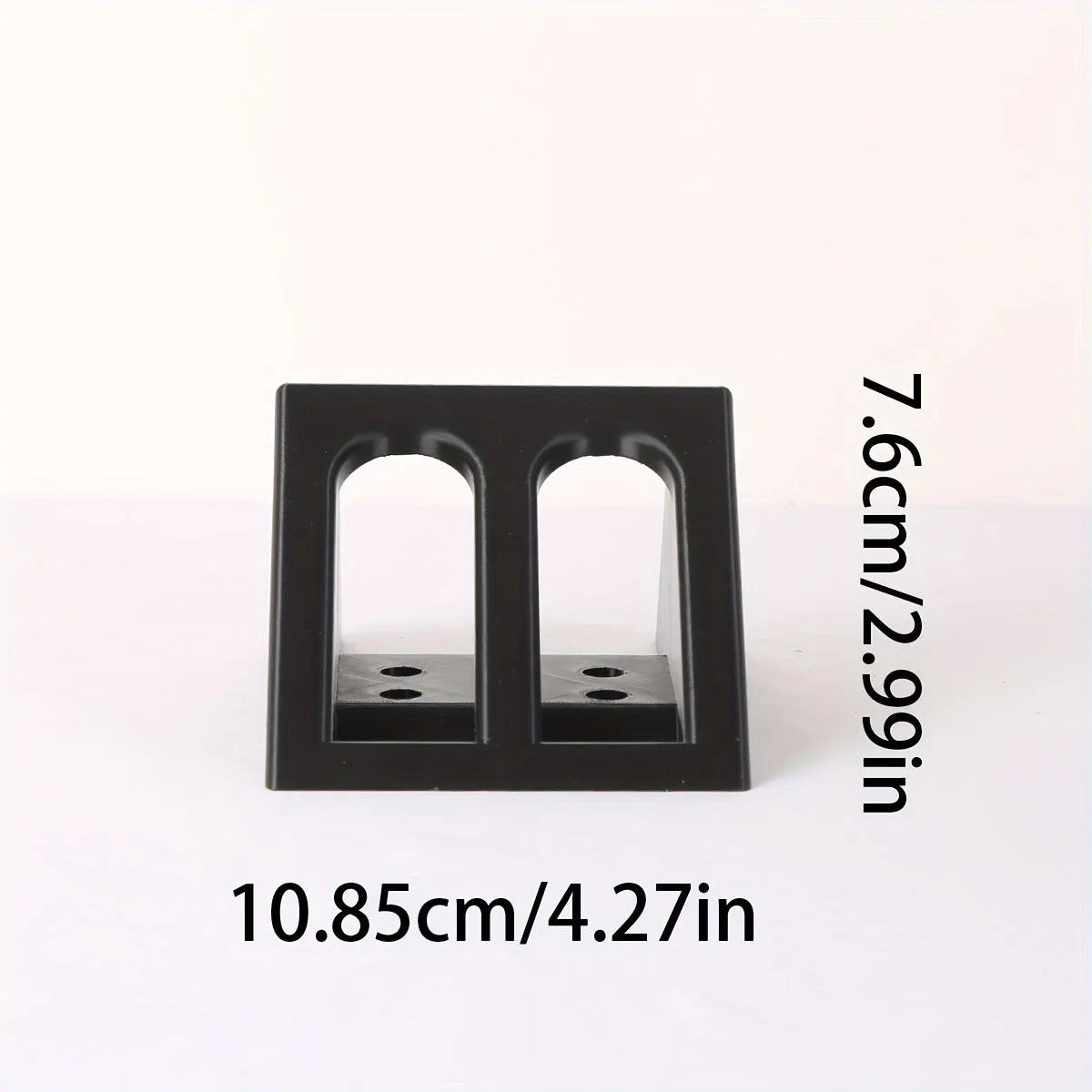 Black plastic pistol stand with punk-style finish for displaying collectible handguns