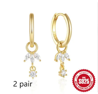 S925 sterling silver earrings with a geometric sunflower design and golden zircon inlay.