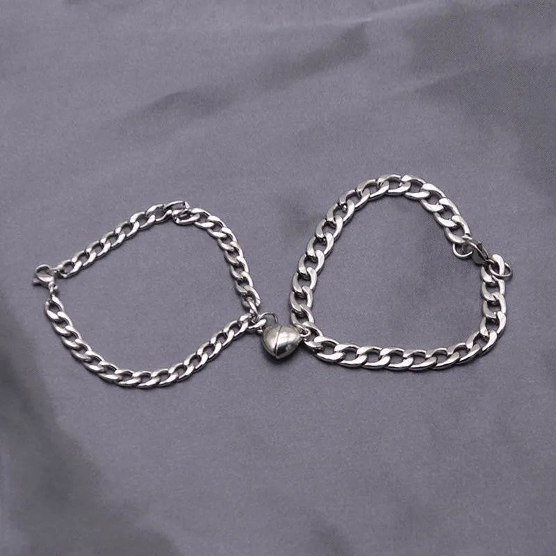 Silver magnetic couple bracelet with heart charm on stainless steel chain