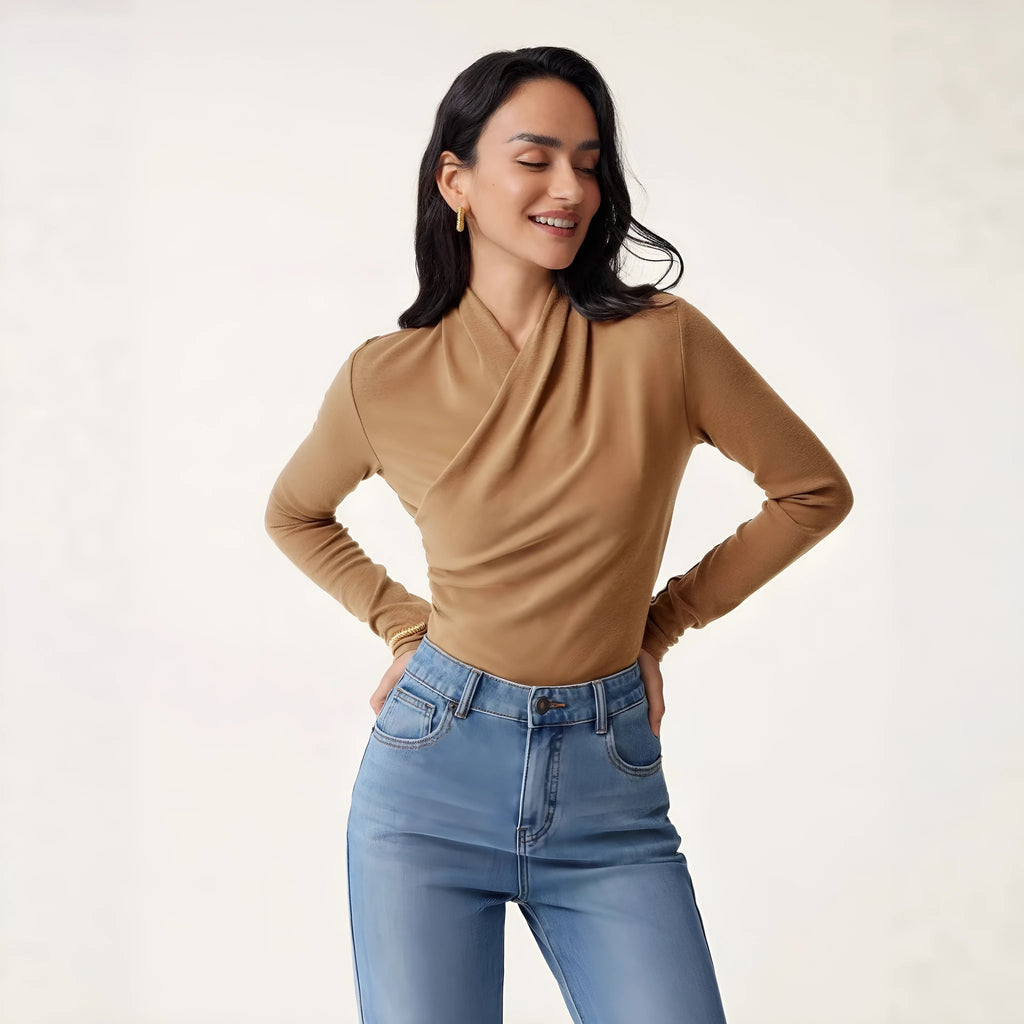 Camel coloured women's slim fit long sleeve pullover sweater on a hanger.