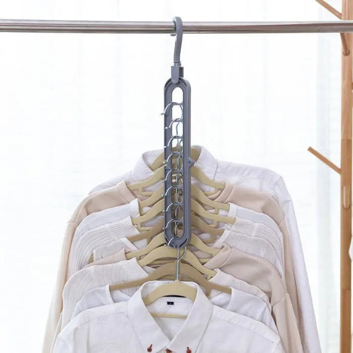 Plastic clothes hanger with rotating hook in pink colour, showing 33cm length dimension