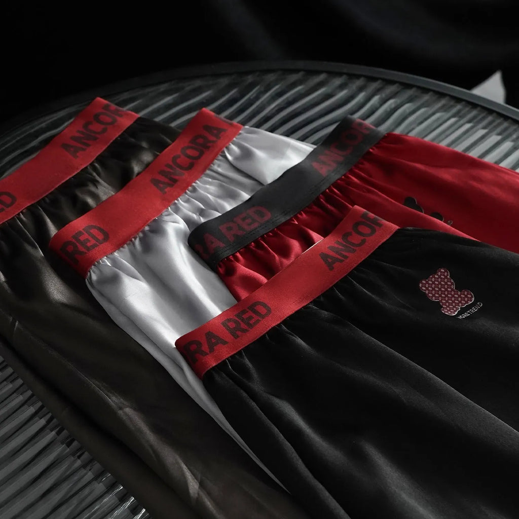 Men's solid colour boxer briefs in black, shown with mid waist design.