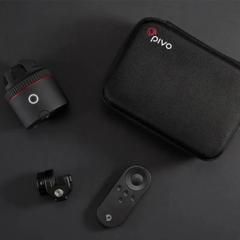 Black PIVO facial tracking camera for smartphones on a table, showing its matte finish.