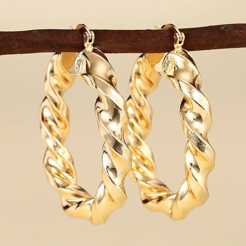 Copper geometric ring design ear clip earrings for women in assorted colours.