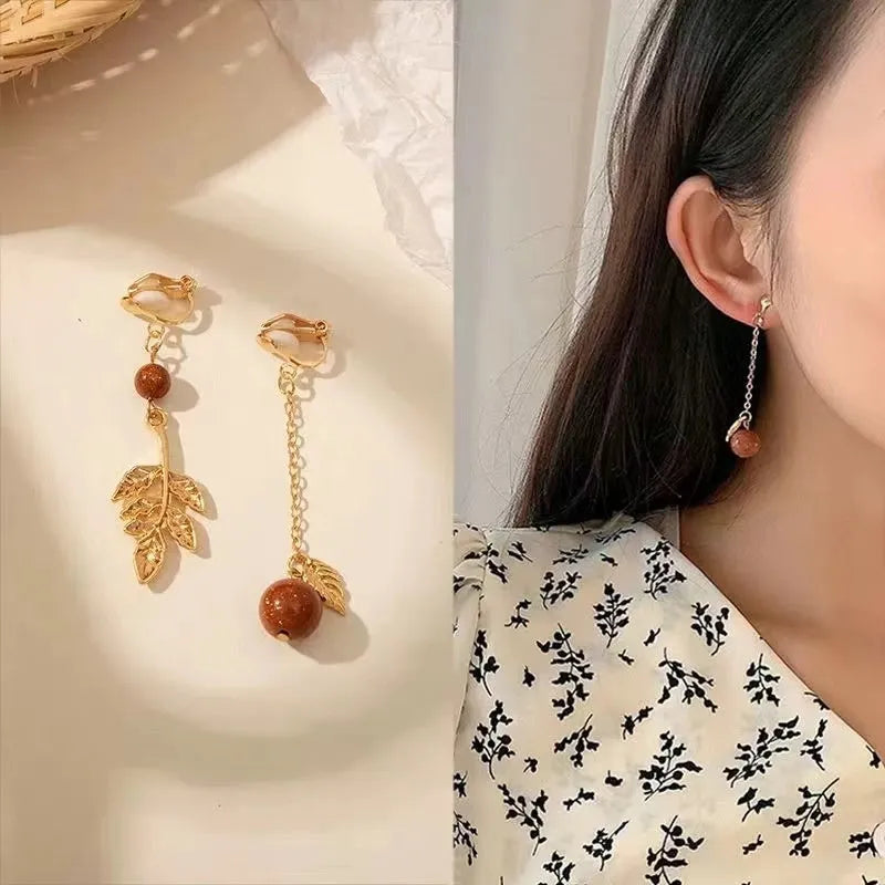 South Korean fashion alloy geometric ear clips with tassel pearl design in silver colour
