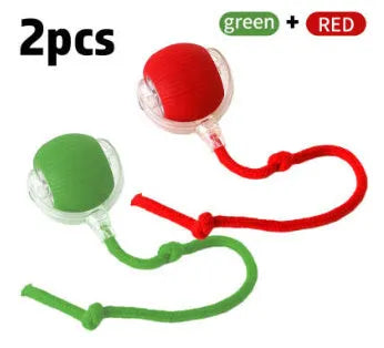 Silicone rolling ball cat toy in red, green, or grey colours, some variants with an attached rope.