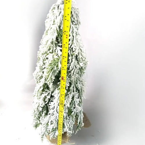 24-inch small artificial Christmas tree with snow spray decoration and built-in lights on desktop