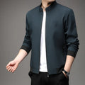Man wearing a black Korean-style loose lapel casual jacket with zipper pockets.
