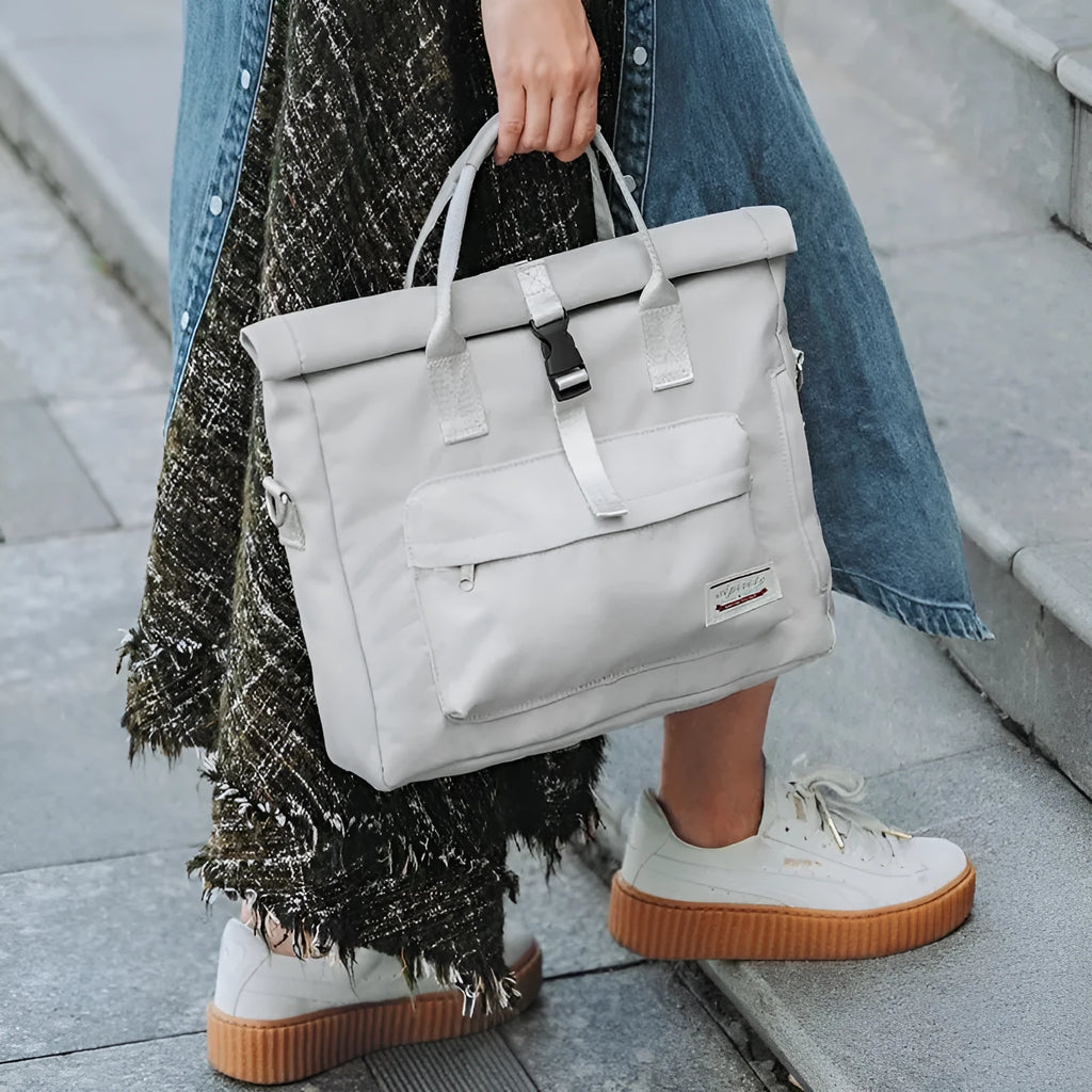 Shockproof anti-drop inner liner laptop bag in nylon, shown in beige gray, cherry blossom pink, and starry black colours.
