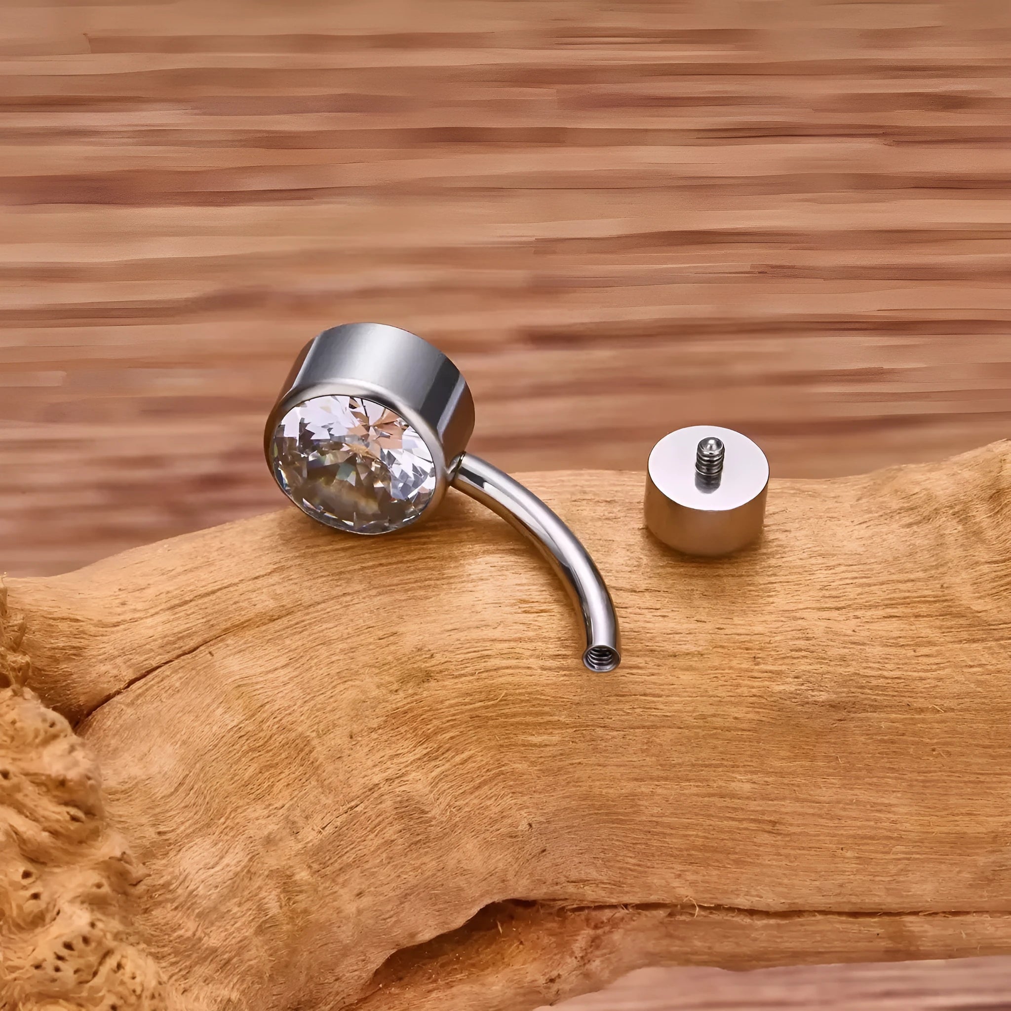 Double-headed zircon titanium alloy navel stud in multiple colours and sizes.