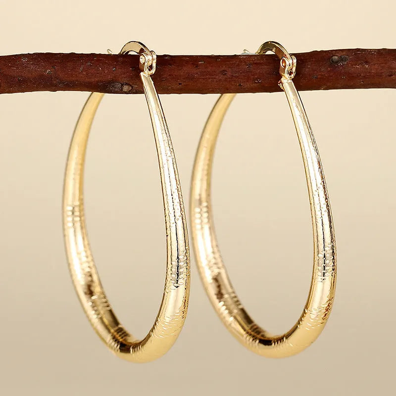Copper geometric ring design ear clip earrings for women in assorted colours.