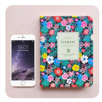 Green fabric imitation leather floral notepad open on a desk, showing custom logo printing and Daolin paper.