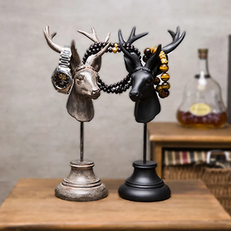 Tall black natural resin animal sculpture decoration on a wooden shelf.