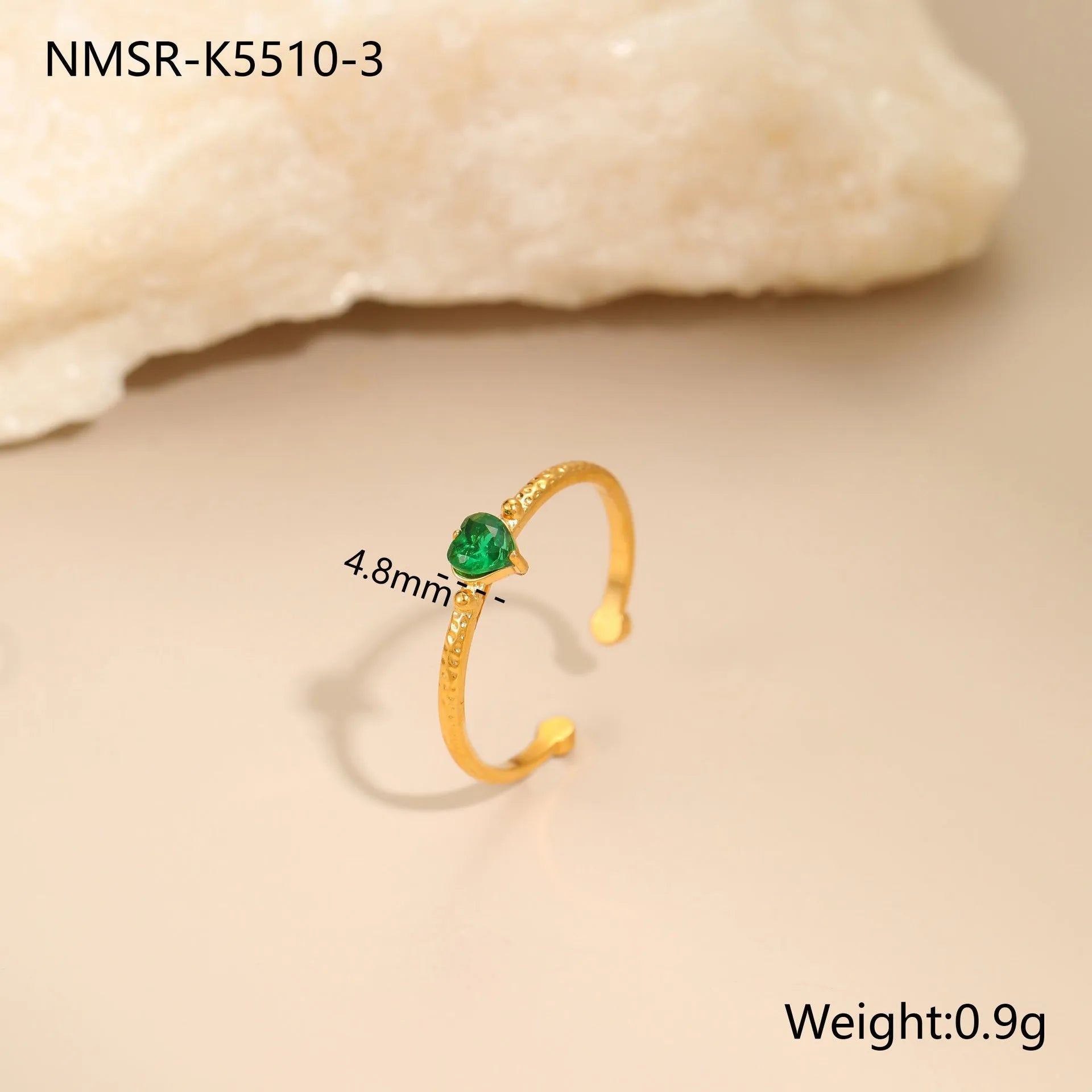 Open ended stainless steel ring with a geometric zircon-inlaid heart in white, pink, or green.