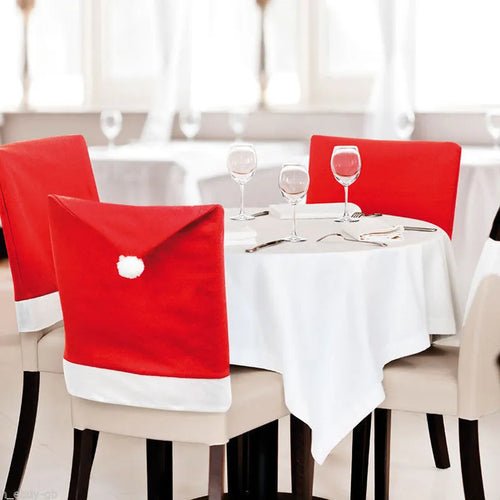 Christmas chair covers set with Santa Claus, Snowman, and Santa hat designs on dining chairs