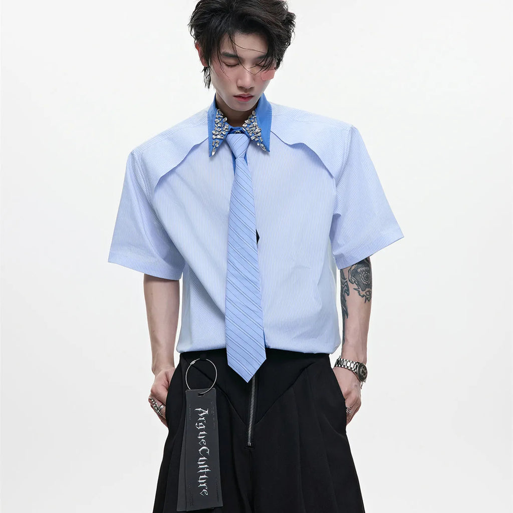 Men's blue and khaki patchwork striped shirt with diamond tie detail and quilted texture.