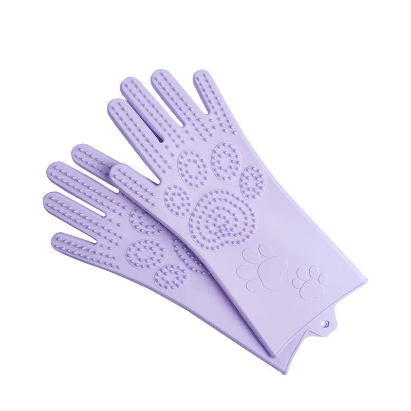 Blue silicone scrubbing gloves showing textured palm and finger surfaces for cleaning