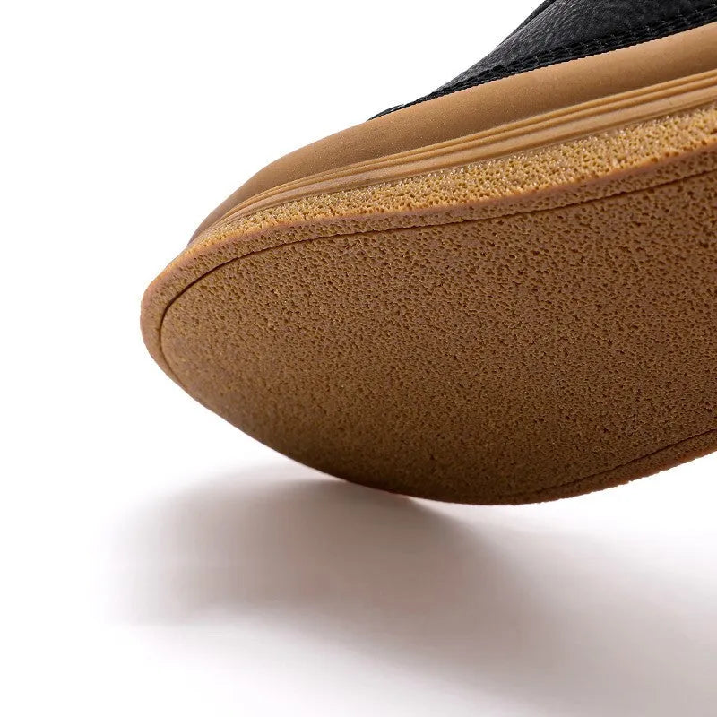 Men's black leather casual shoes with round toe and flat rubber sole, shown with lace-up closure.