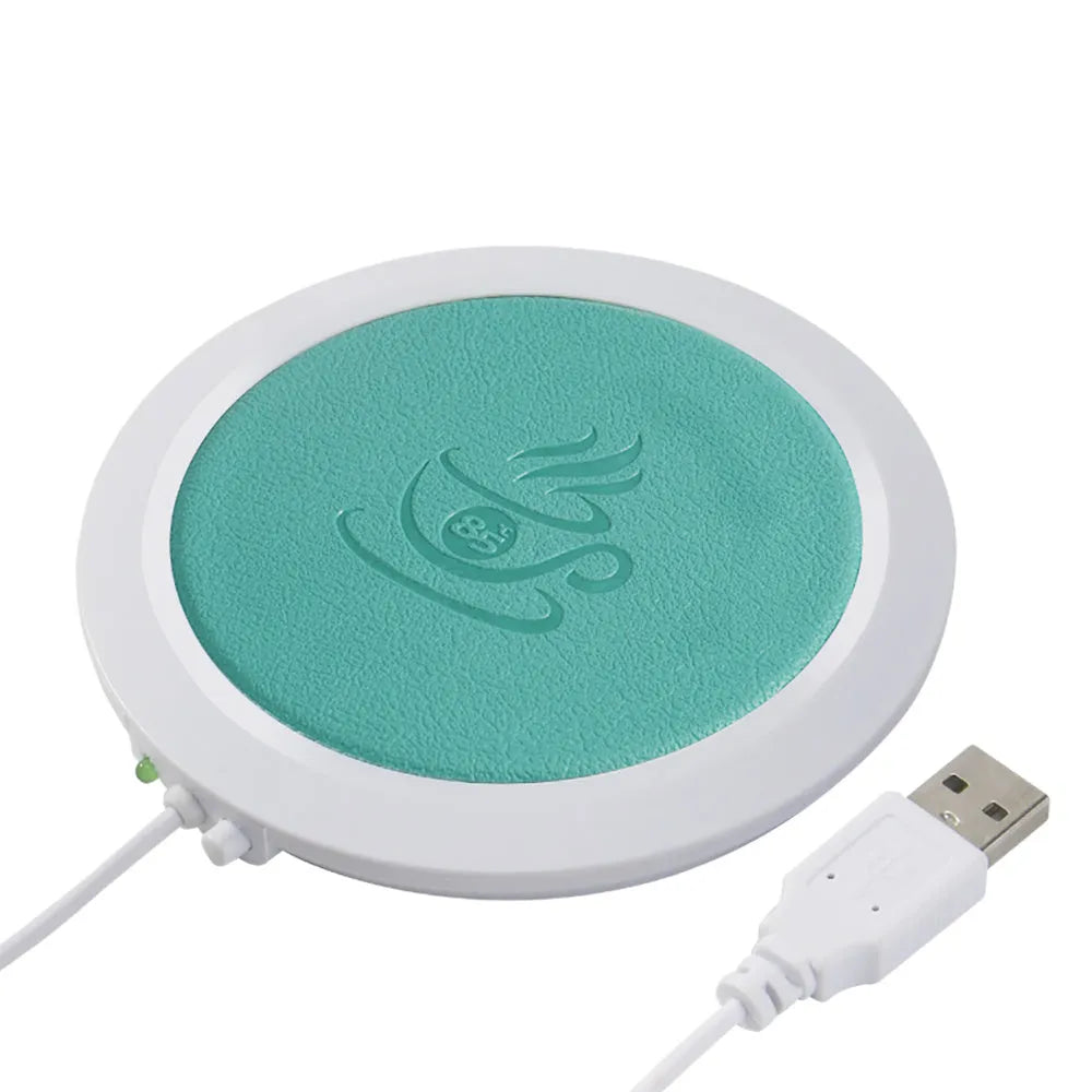 Black USB-powered high temperature heater with insulated base on a desk.