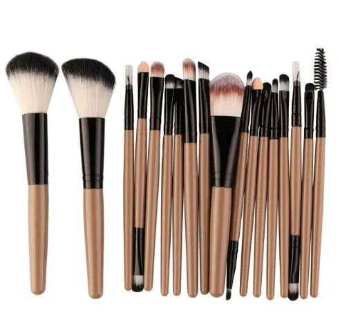 18-piece makeup brush set with fan brushes arranged on a table.