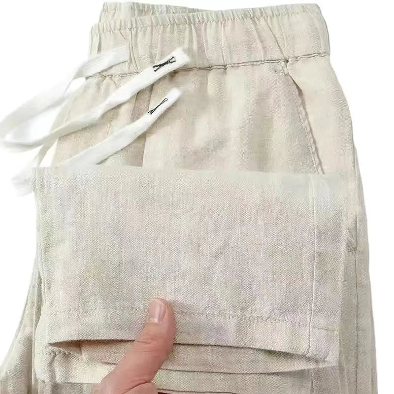 Pure linen Chinese-style straight leg trousers with a drawstring waist in apricot colour.