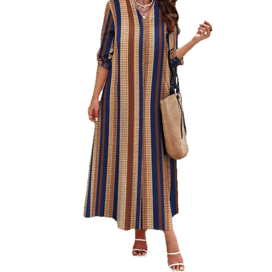 Camel coloured women's casual dress with vertical stripes, V-neck, and long A-line skirt.