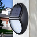 Black LED solar wall light with solar panel and automatic sensor for outdoor use