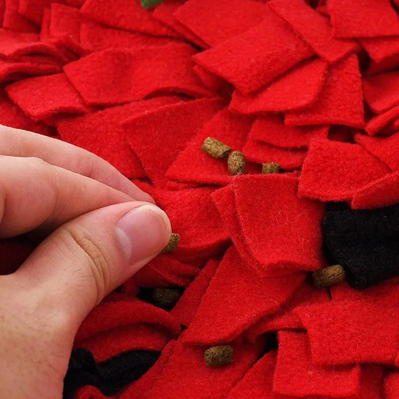 Red and green strawberry-shaped pet slow feeder mat with hiding spots measuring 45x35 cm