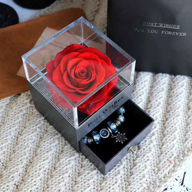 Eternal Flower gift box with preserved roses and carnations inside, measuring 8.5 cm square by 10.5 cm high