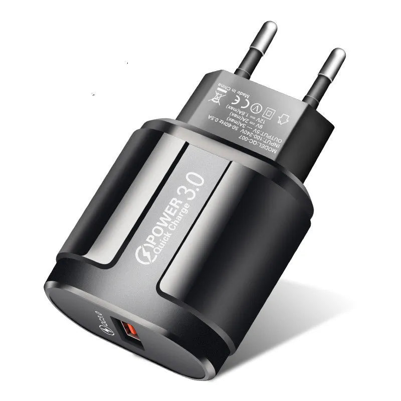 White and black international smartphone charger with UK, US and EU plug options