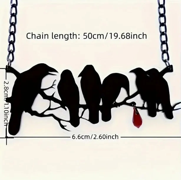 Black electroplated alloy crow pendant necklace on a cross chain for women.
