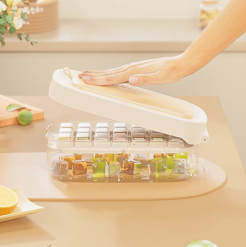 Yellow high-capacity ice cube tray with grid design and a storage slot for an ice shovel.