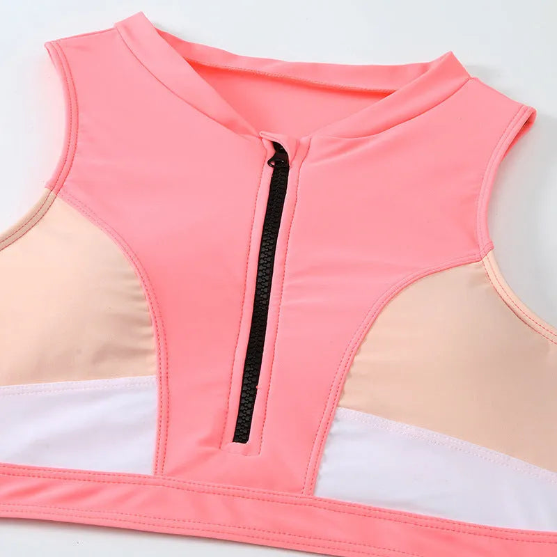 Pink high-waist bikini set with matching bra and shorts on neutral background