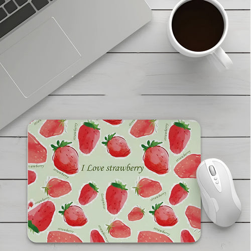 Custom cartoon design on a small black thickened mouse pad with stitching, shown on a desk.
