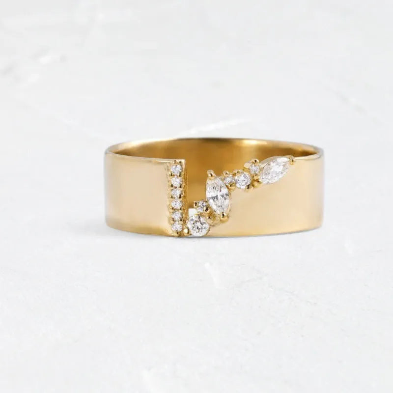 Gold-plated copper ring with shining zircon stones on a white background