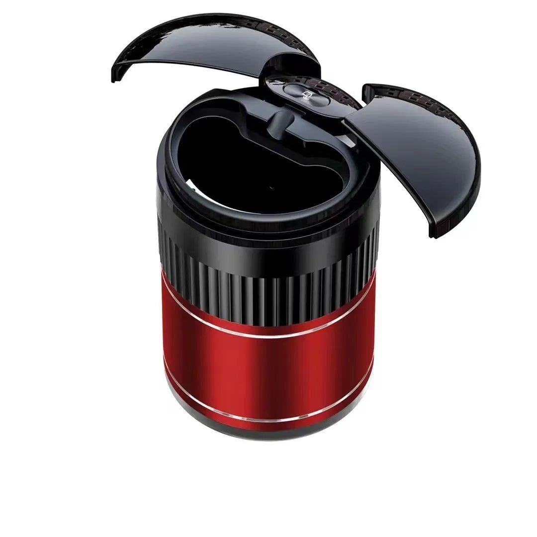 Black automatic infrared sensing metal car ashtray with lid on a car dashboard.