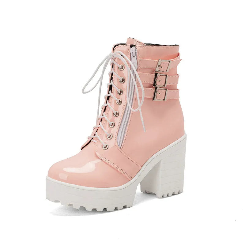 Women's black thick-heel ankle boots with round toe and front lace-up design.
