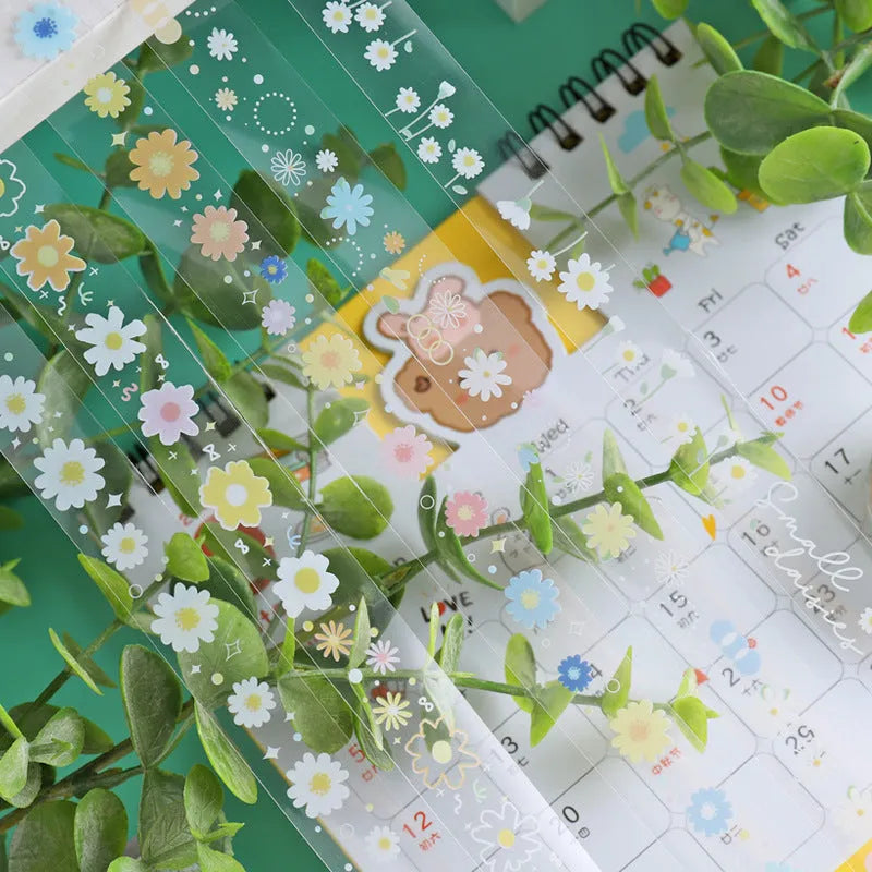 Five rolls of transparent adhesive tape with a Midsummer Daisy cartoon pattern, each 1.5cm wide.