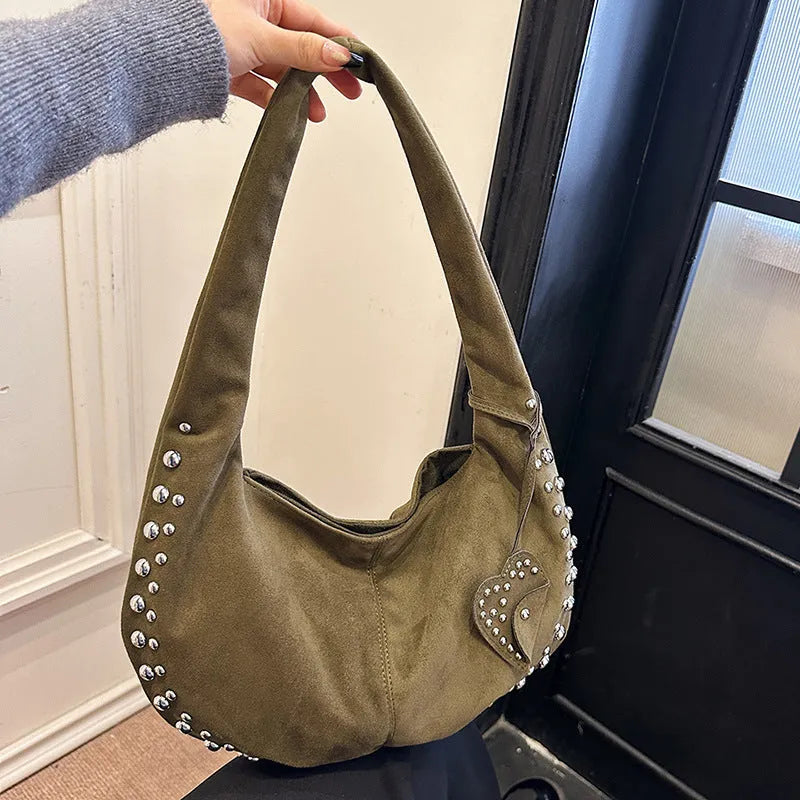 Soft plush retro style tote handbag for women in a choice of colours, shown as a strapless design.