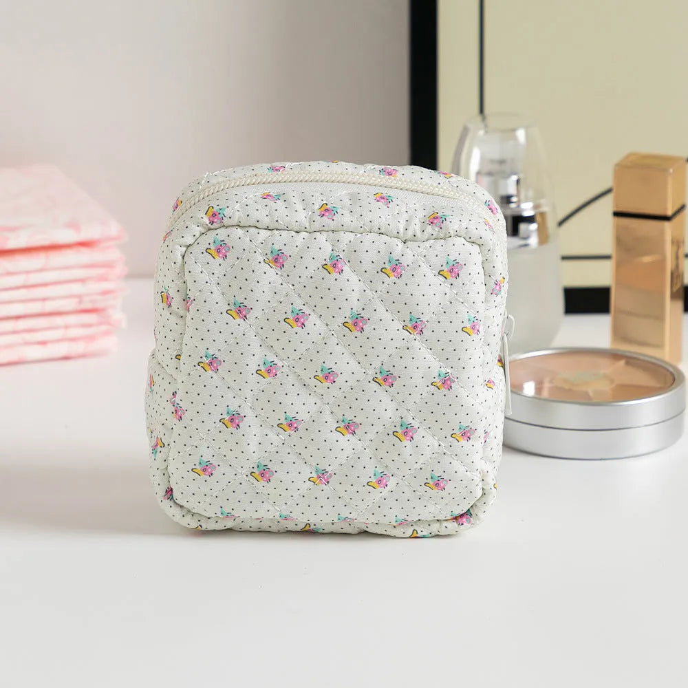 Women's floral patterned polyester key storage bag with sewing thread detail.