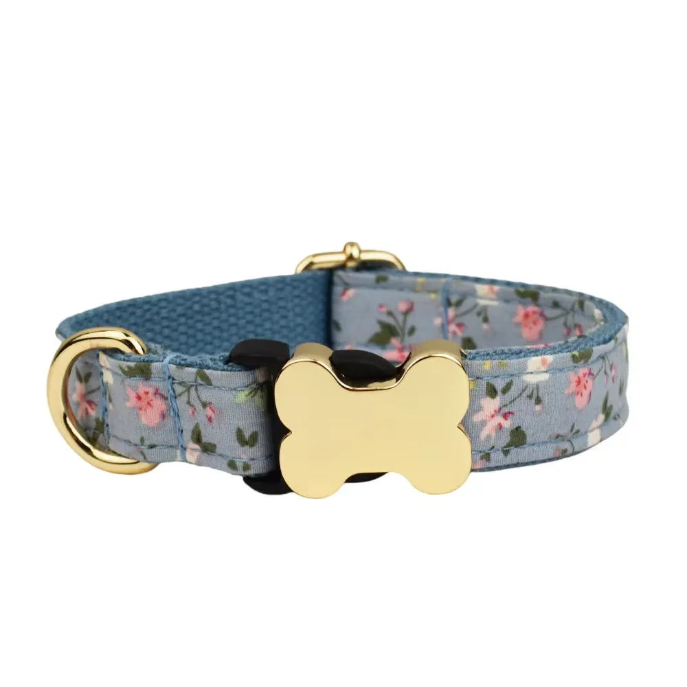 Flat nylon dog collar with a printed grid pattern and a silver bone-shaped metal buckle on a white background.