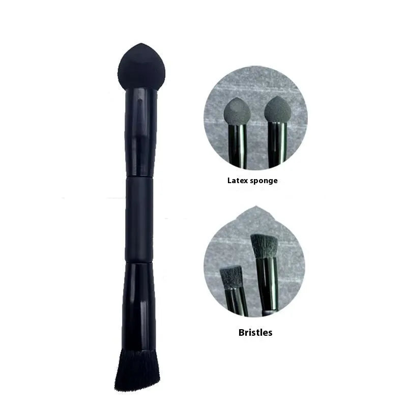 Black concealer brush with a tapered fibre head and wooden handle for makeup application.