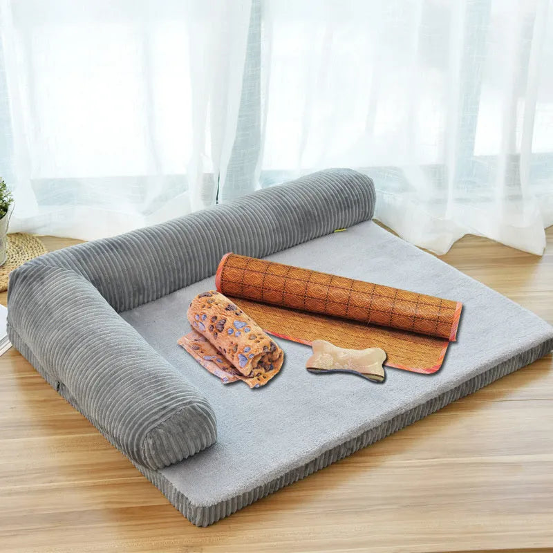 Corduroy bolster dog bed in grey, showing bilateral raised sides and non-slip base.