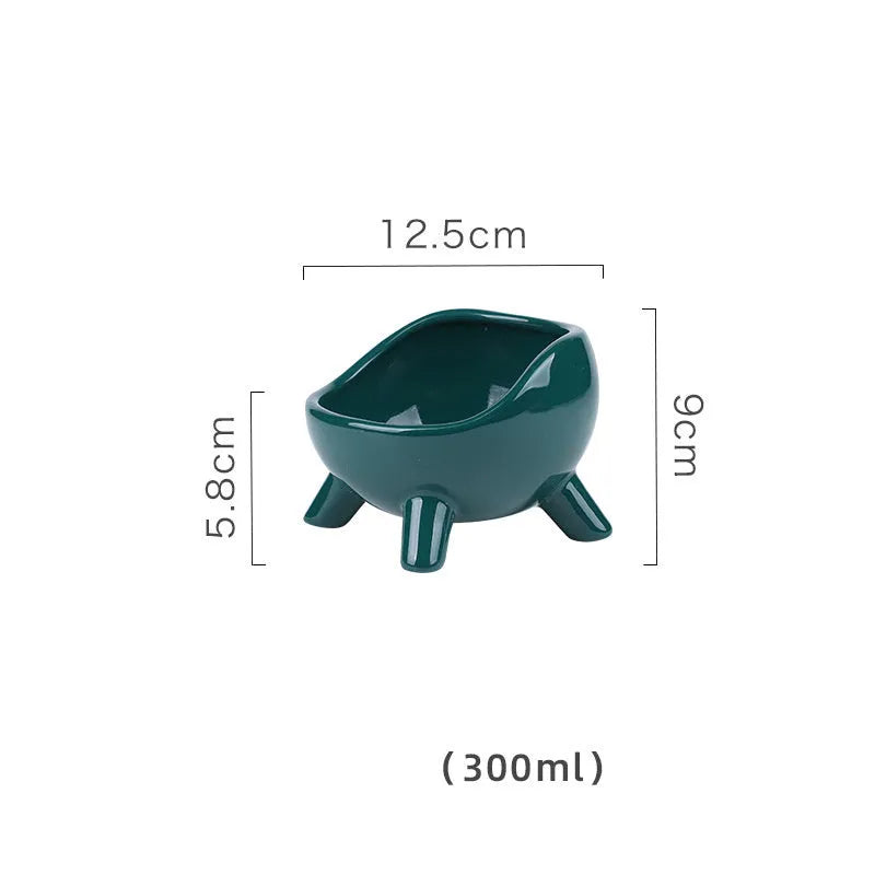Green ceramic pet bowl with four-legged stable base and wide-mouth design