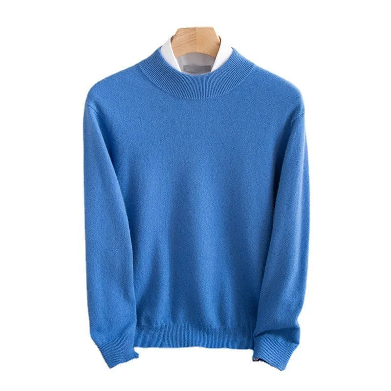 Man wearing a half-collar loose wool sweater in a textured rough yarn knit.